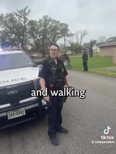 American police harass black woman for walking on the “wrong side” of the road in the suburbs.