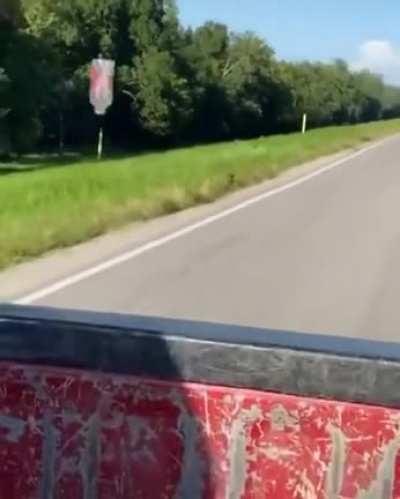 Empty bottle being dragged along behind a car due to the aerodynamic drag