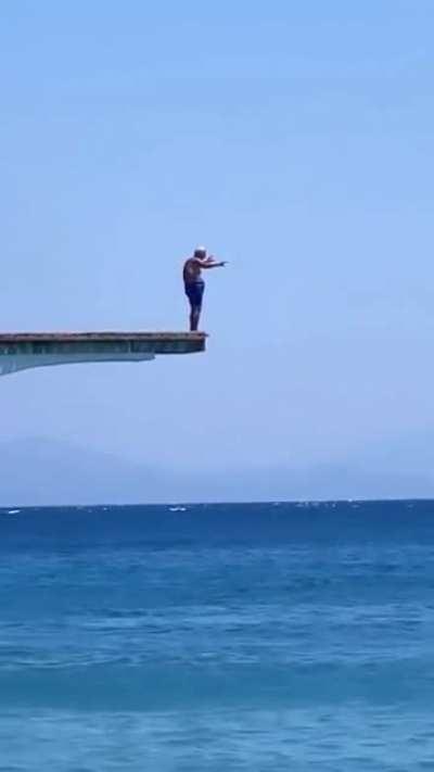 92 year old man having his morning dive in Greece.