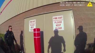 These police officers got word that people were stealing items and bringing them out the back door, so they simply waited for them to come out.