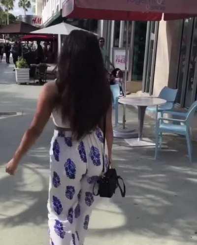 Walking behind her