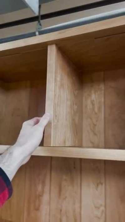 Client wanted a bookcase with sliding dividers. Anyone seen this done before?
