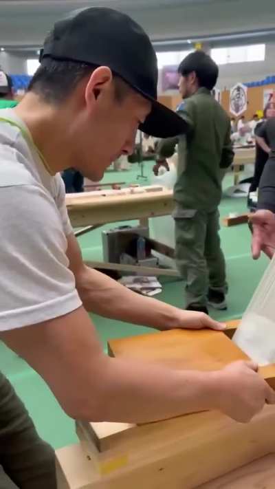 Japanese carpenter checks his blades