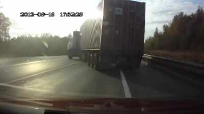 Truck driver almost causes a head-on collision with another truck. Driver turns into a stuntman