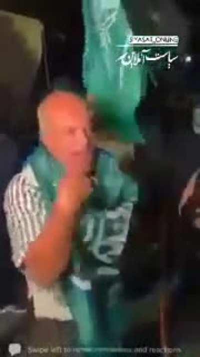 Lebanese gather for a protest holding up the Saudi Flag saying it is their flag