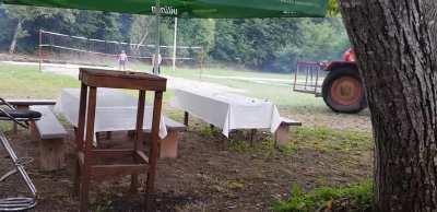 A guy learning how to drive a tractor ends up in a swimming pool