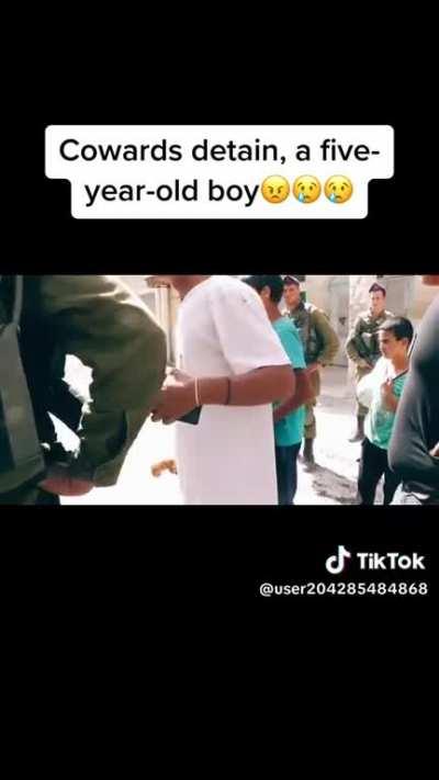 Apartheid soldiers forcibly detain a 5 year-old boy