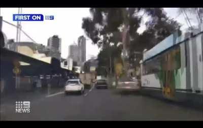 Car got crushed between tree and tram. Luckily, no one was seriously injured.