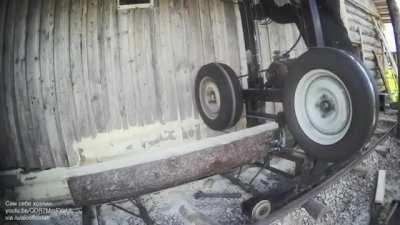 Homemade bandsaw mill from old car wheels
