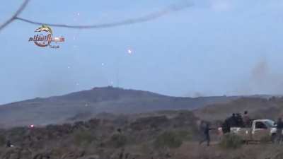 A pair of FSA techincals tag team distant Syrian Army hilltop positions with erratic fire - 2014