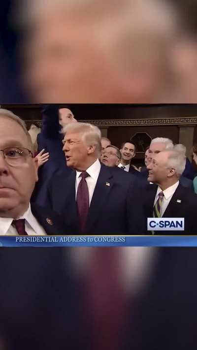 GOP lawmaker grabs ‘This is not normal’ sign out of Dem reps hands ahead of Trump’s speech