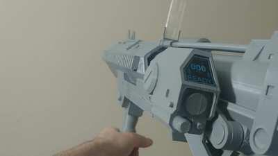 Kinda new to Reddit, but I 3d modeled and printed the Reach Grenade Launcher with a bit of functionality to it! It's unpainted, but it's fully assembled.