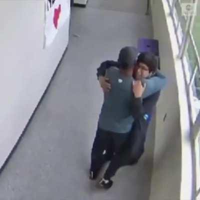 Coach disarms Oregon student with a gun then embraces him.