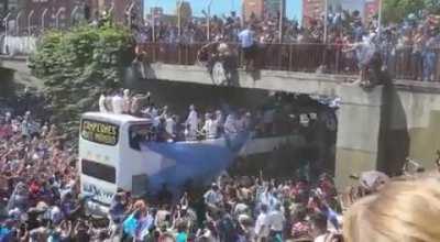 Argentinian fan falls down the Argentina team bus.