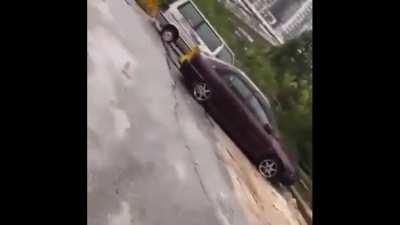 25th January 2022 : The ground collapses as people try to move their cars away - Kuala Lumpur, Malaysia