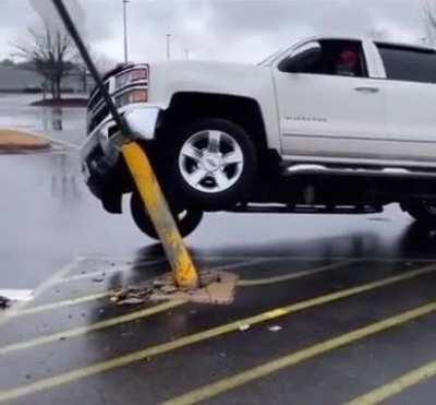 Boomer manages to park his truck halfway up the only pole in the parking lot 