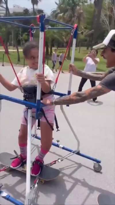 This guy, who loves to board himself, uses a modified frame so that kids who can't normally enjoy skateboarding get a chance to enjoy it for the first time.