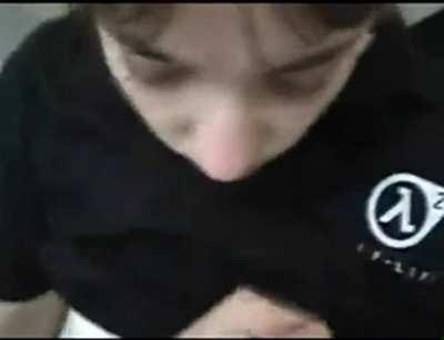a girl with Half Life 2 shirt shows it and swallows it