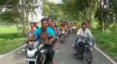 Showboating on a bike with no helmets and reckless driving