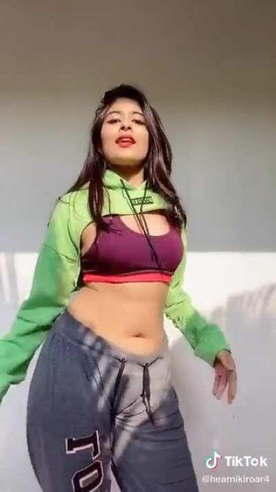 Put your cock inside Nikita Sharma's navel, and she will grind it to cum.