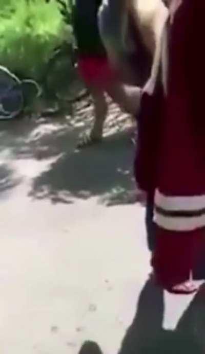 after getting beaten, girl forced to get on her hands and knees to kiss feet.. ends up getting head stomped to the ground.