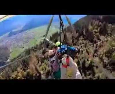 Hand glider pilot forgot to attach his passenger...