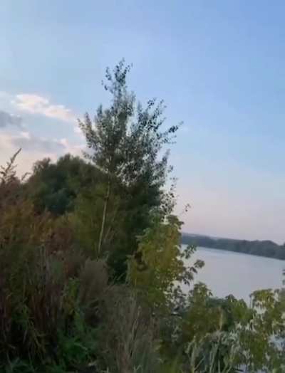 Projectile strikes drone overhead of fisherman