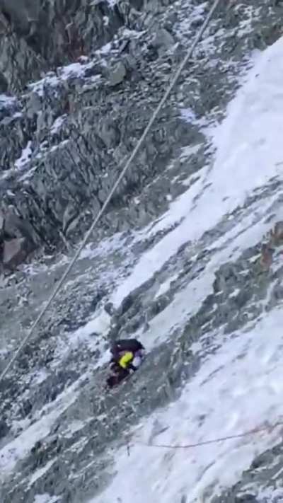 Mountain climber gets caught in rock collapse