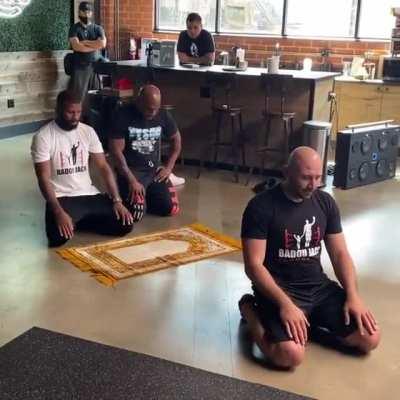 Jack Badou and Mike Tyson praying together