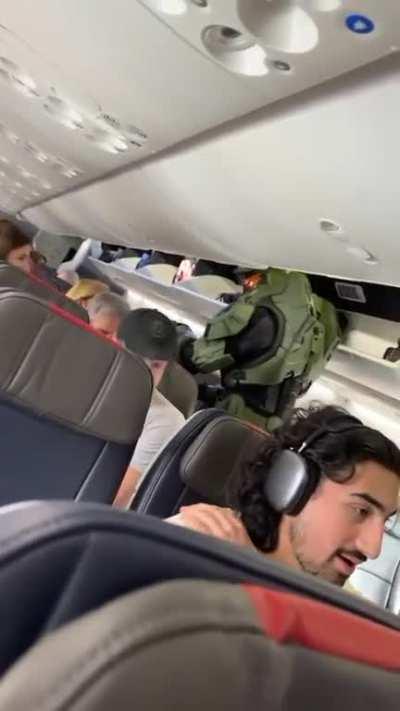 You go to fly somewhere and this guy sits next to you