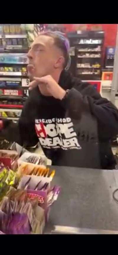 store clerk is tripping balls behind counter