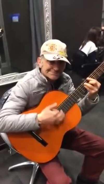 Old man playing western Ennio Morricone music