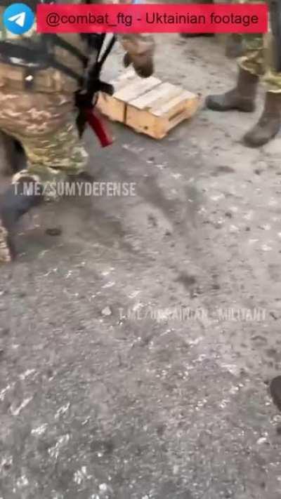 Ukrainian soldiers drone bombing Russian convoy.
