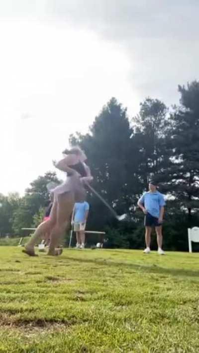 WCGW Swinging a golf stick.