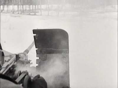 88 and 20mm flak guns on a train engage a Soviet partisan strongpoint on the Eastern Front in early 1942