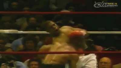 Mike Tyson in his prime dodging a barrage of punches and delivering the knock out blow