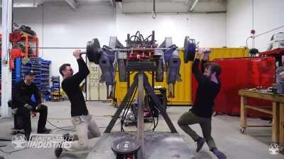 The crew at hacksmith industries, doing pull-ups on a multi-thousand dollar mech project