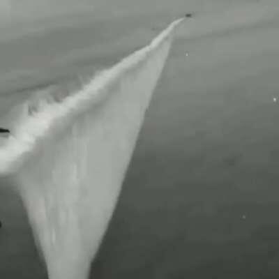 Pre-WWII footage of a smoke curtain, used to hide ships during a naval battle, being deployed.