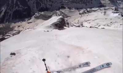 Skier snags a rock trying to ski down a 1000 ft slope in Aspen, CO 
