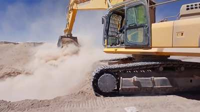 The Big Yellow Machine: Komatsu PC450 at work in the quarry.