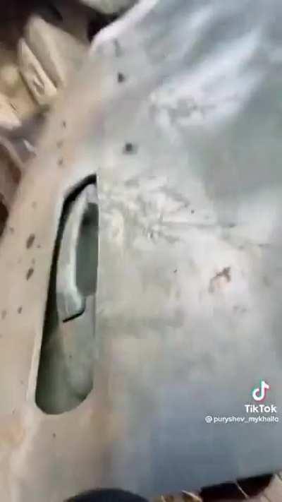 Ukrainian soldiers evacuate an elderly woman under heavy artillery