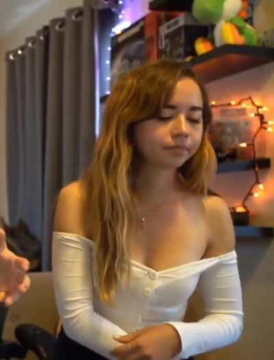 Maya Higa lowering her top