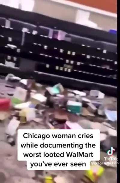 woman heartbroken after seeing the local store looted in chicago