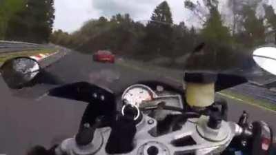 Motorcycle getting hit by car at 105 mph in Nürburgring
