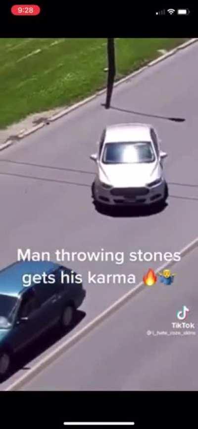 Throwing rocks at car