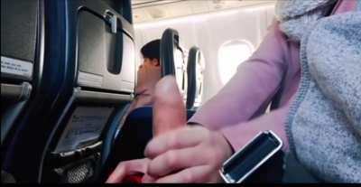 Handjob on a plane next to people