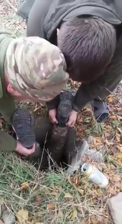 Ukrainian soldiers saving a puppy