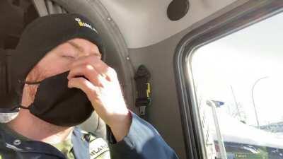 Man using cold air to demonstrate the effectiveness of mask wearing