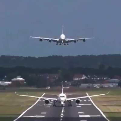 A passenger jet getting airborne 10 seconds before the plane landing behind it touches down