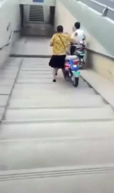 Not riding the scooter when getting it down the stairs